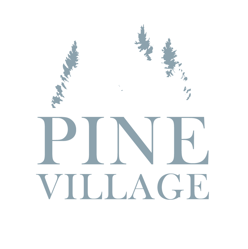 A logo with the words Pine Village and some pine trees.